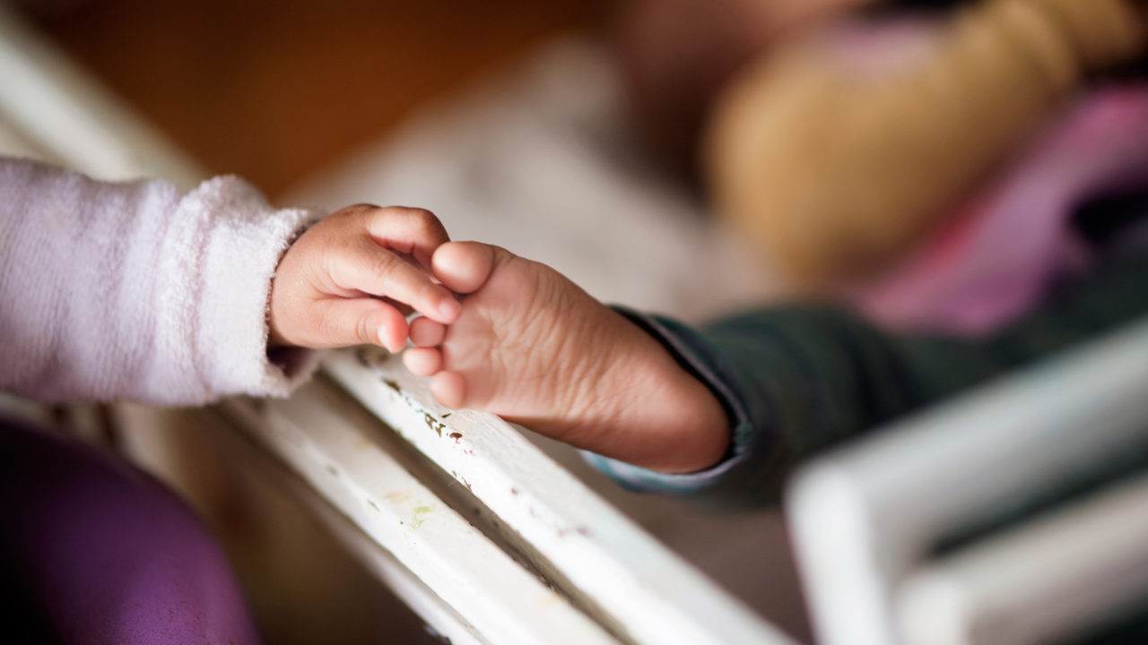 InfantHandTouchingToes